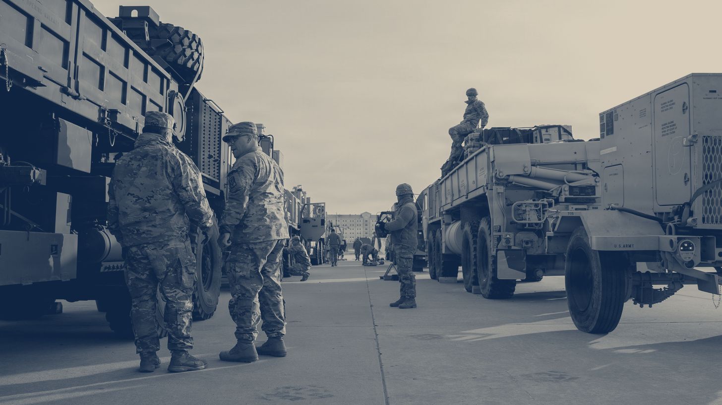 Two-tone U.S. Army photo of 35th Air Defense Artillery Brigade soldiers with Indirect Fire Protection Capability vehicles lined up for a mobility exercise at Camp Humphreys, South Korea, March 2026.