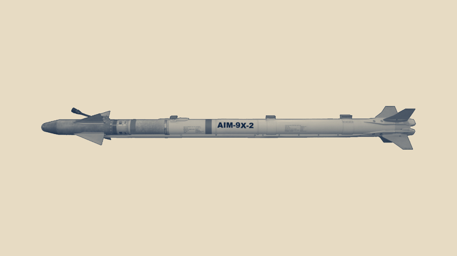 Two-tone U.S. Department of Defense image of an AIM-9X Block II Sidewinder missile in side profile, on a plain sand background.