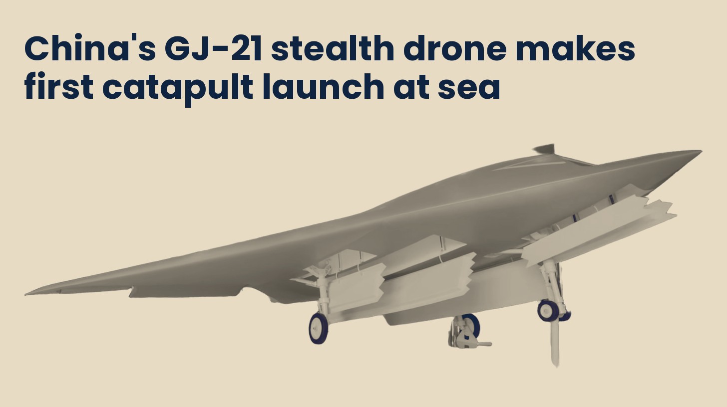 A land-based GJ-11 stealth combat drone on display at Airshow China in Zhuhai in 2021, shown as a stand-in, isolated on a plain sand background.