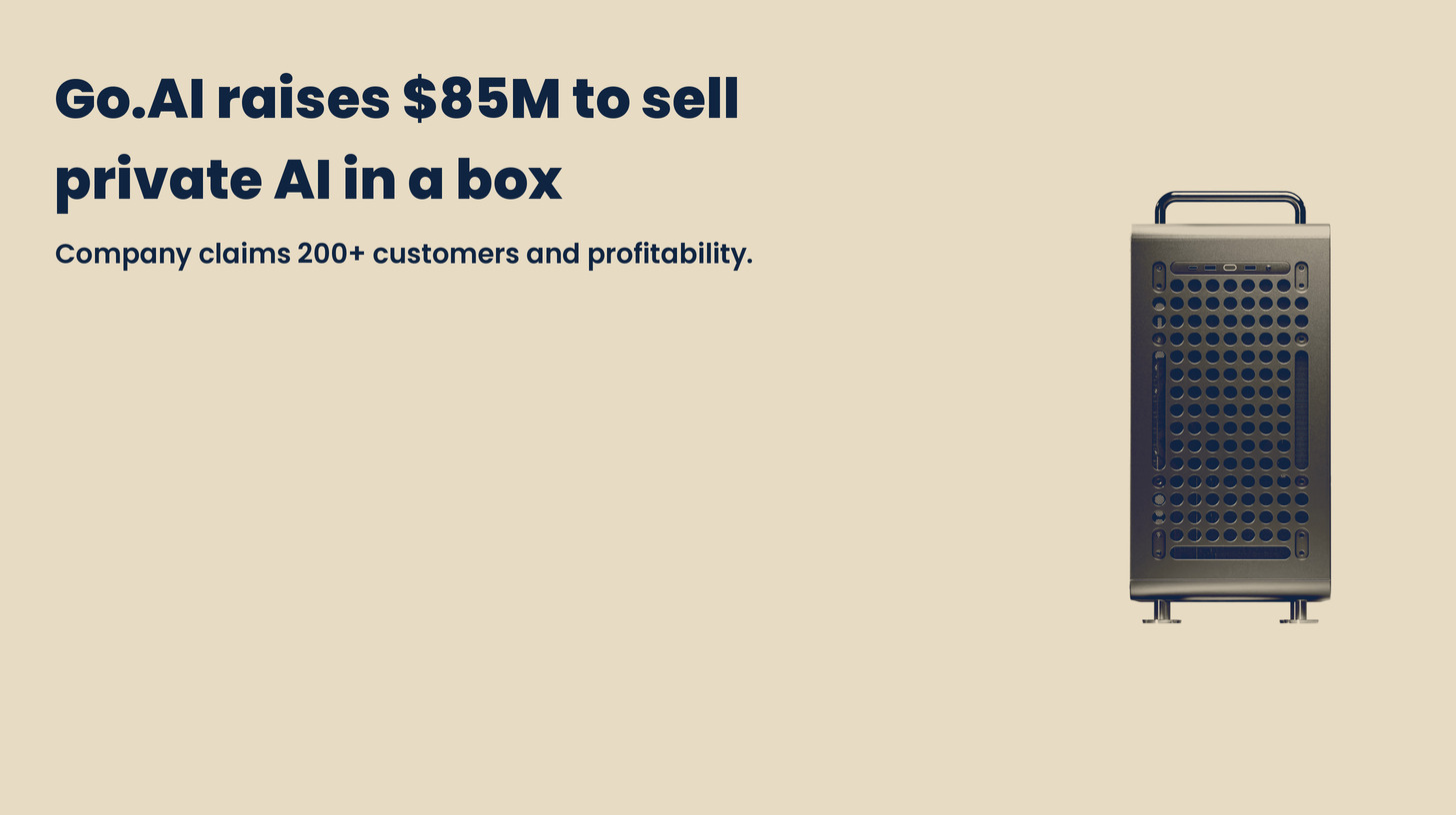 A tower-style Go1 AI server appliance with a perforated front panel and carry handle, in navy and sand tones on a plain sand background. Headline: Go.AI raises $85M to sell private AI in a box. Company claims 200+ customers and profitability.