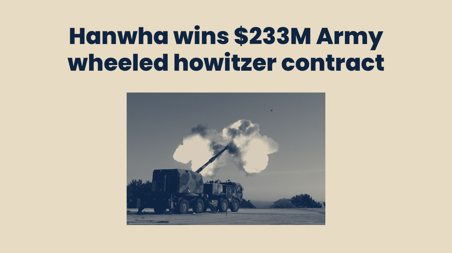 Two-tone Hanwha Defense USA photo of a wheeled K9 mobile howitzer firing with a large muzzle blast, set below the headline "Hanwha wins $233M Army wheeled howitzer contract."