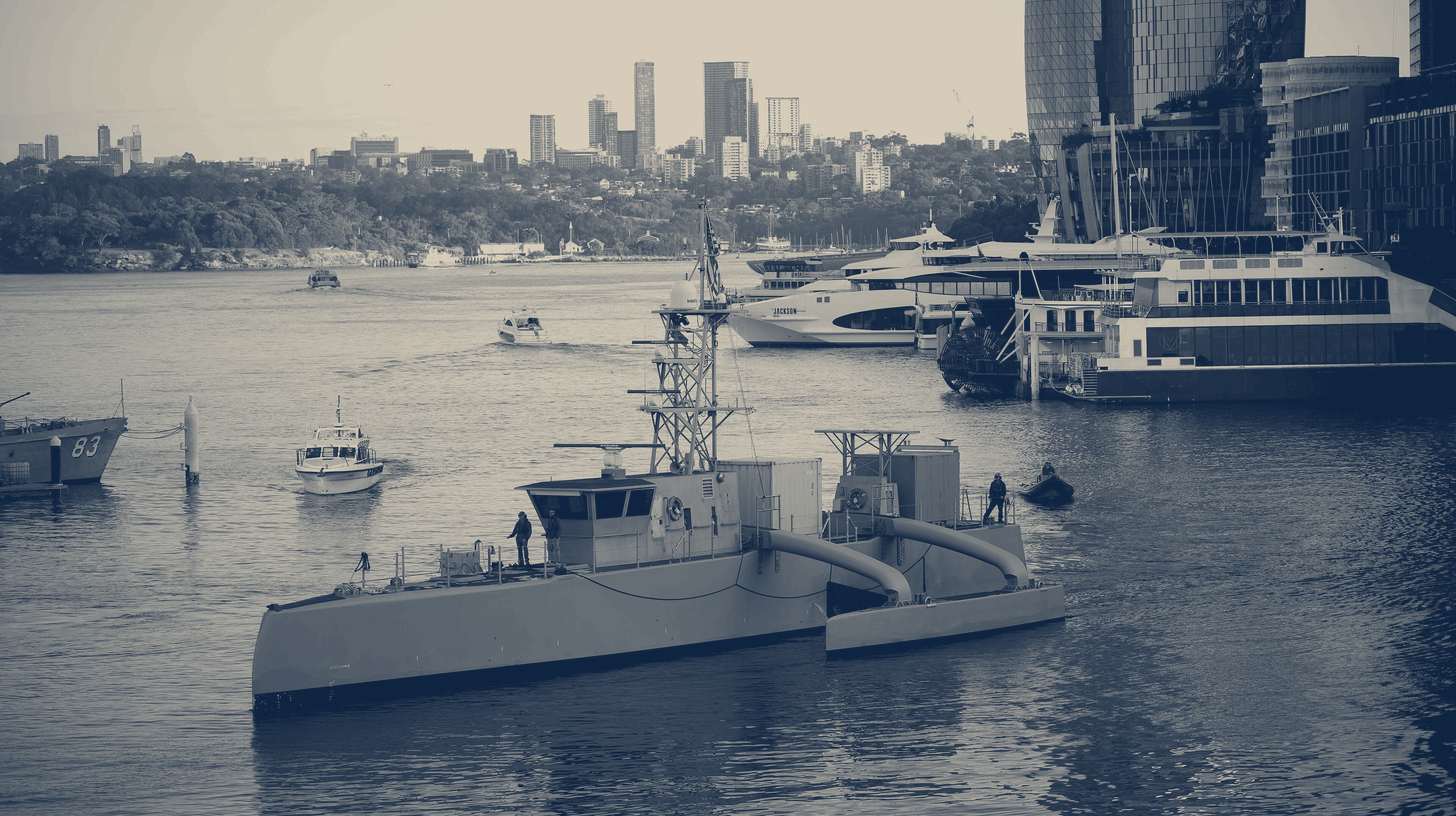 Two-tone U.S. Navy photo of the unmanned surface vessel Seahawk transiting Darling Harbour, Sydney, during Integrated Battle Problem 23.2, November 2023.