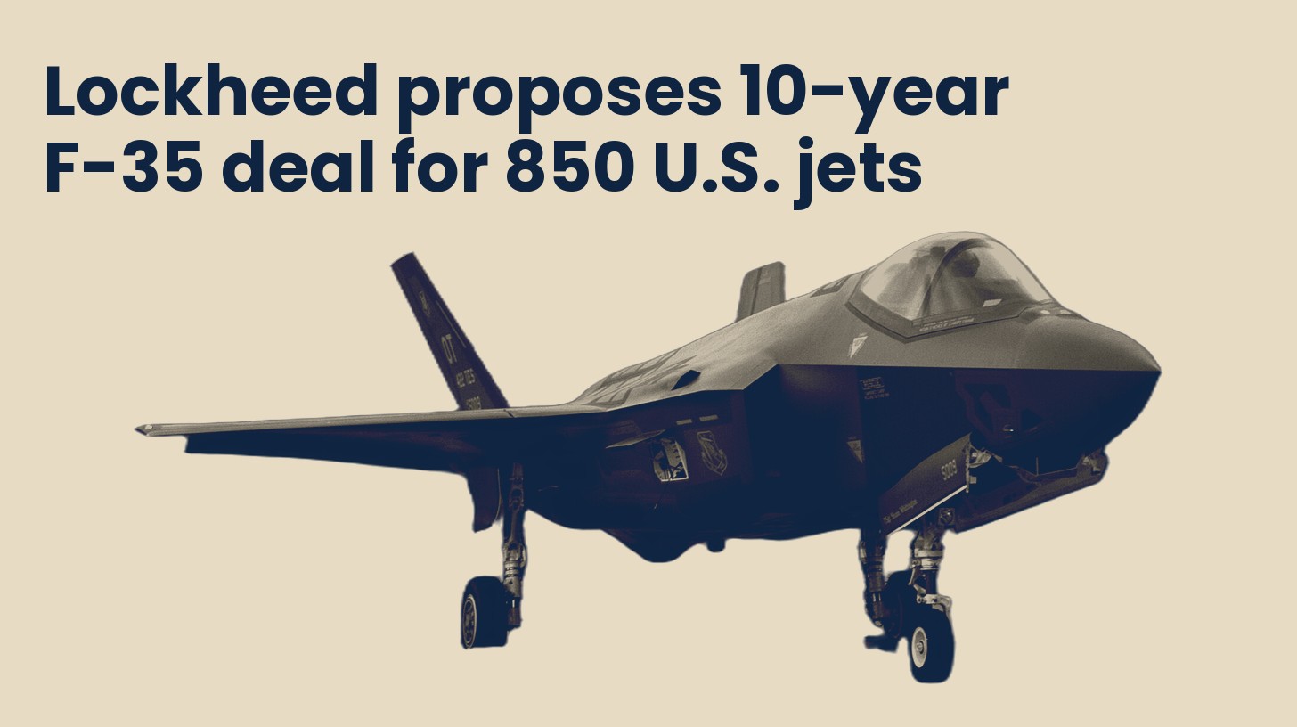 An F-35A fighter jet seen from the front quarter, isolated on a plain sand background.