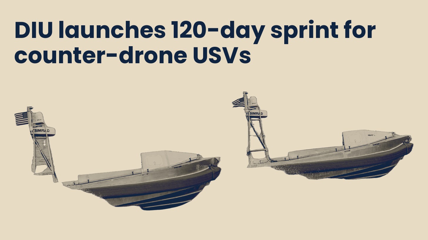 Two small unmanned surface vessels with sensor masts under way, isolated on a plain sand background.