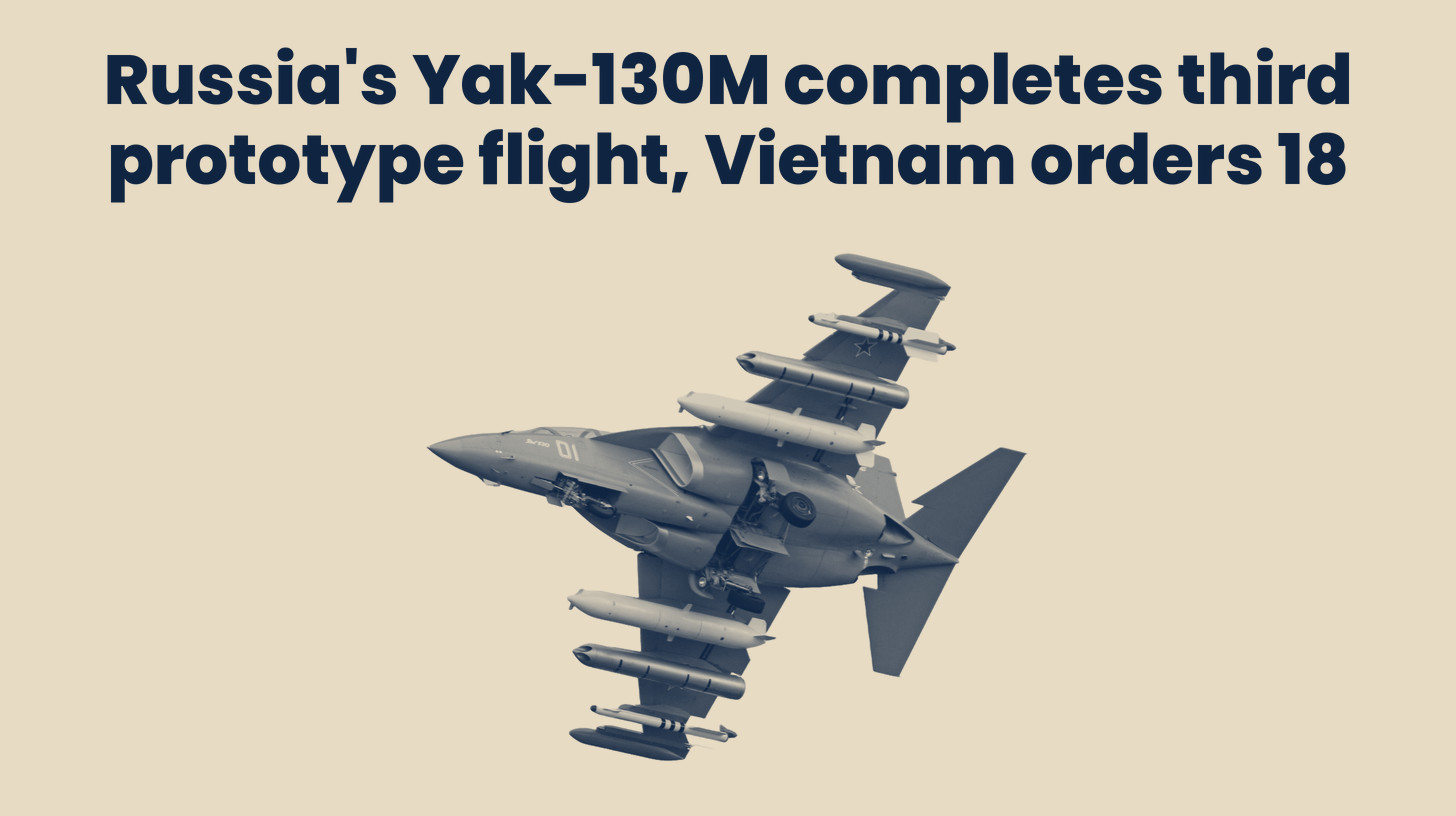 Two-tone photo of a standard Yak-130 trainer banking with underwing stores at an air show in 2012, not the new Yak-130M variant, cut out on a sand background, set below the headline "Russia's Yak-130M completes third prototype flight, Vietnam orders 18."