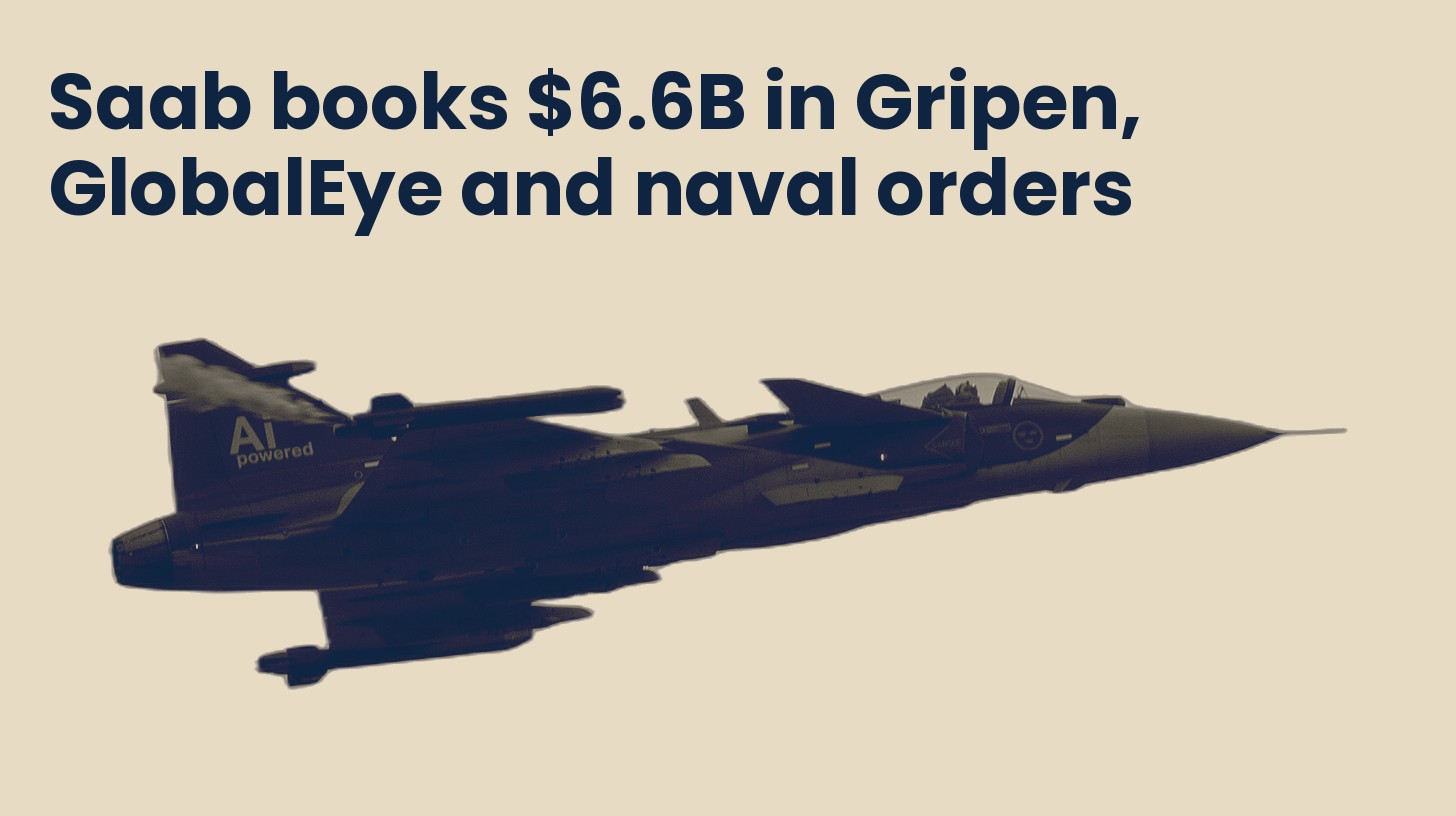 A Saab Gripen E fighter jet in flight, isolated on a plain sand background.