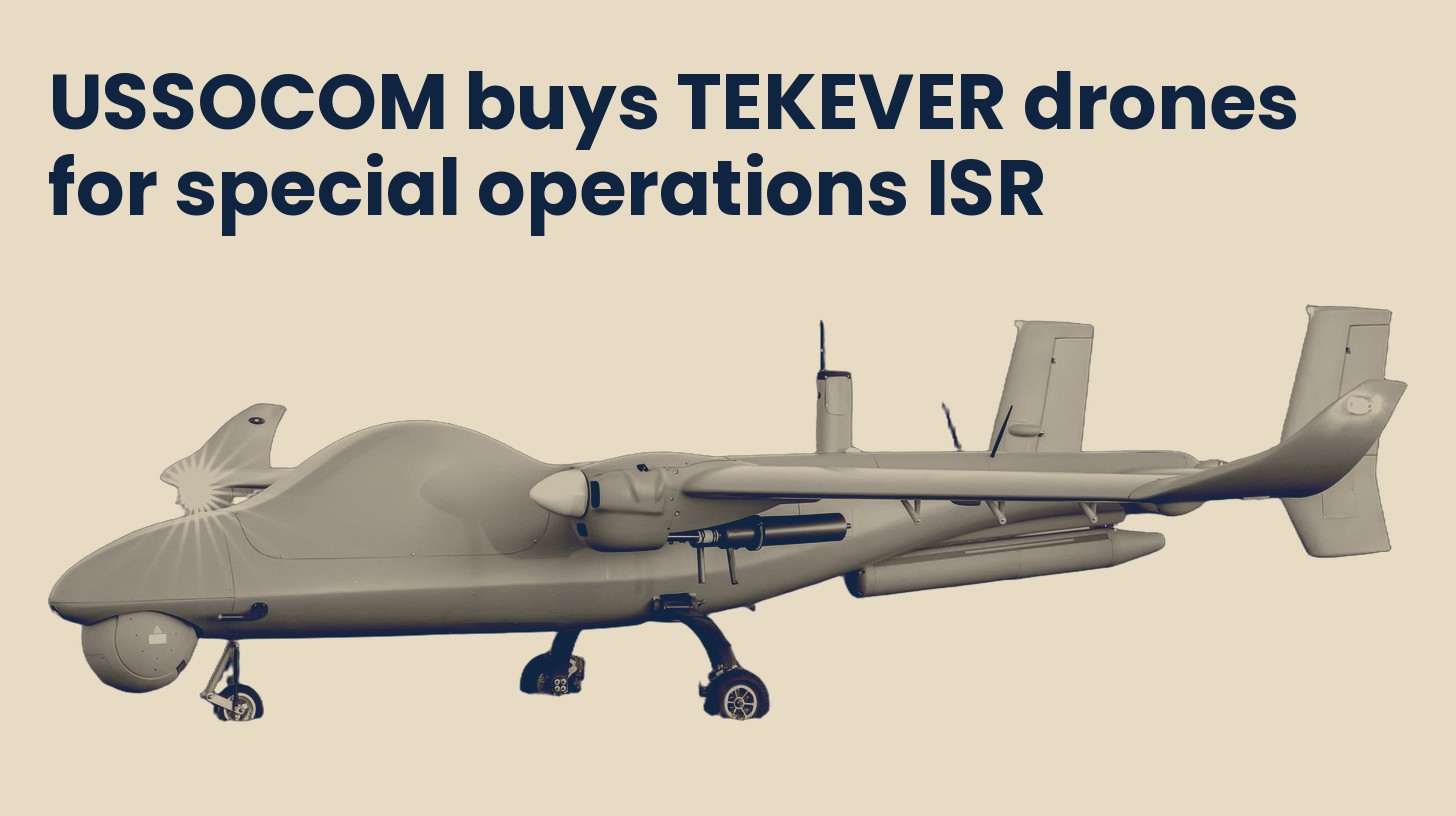 A TEKEVER AR5 fixed-wing drone with twin tail booms, isolated on a plain sand background.
